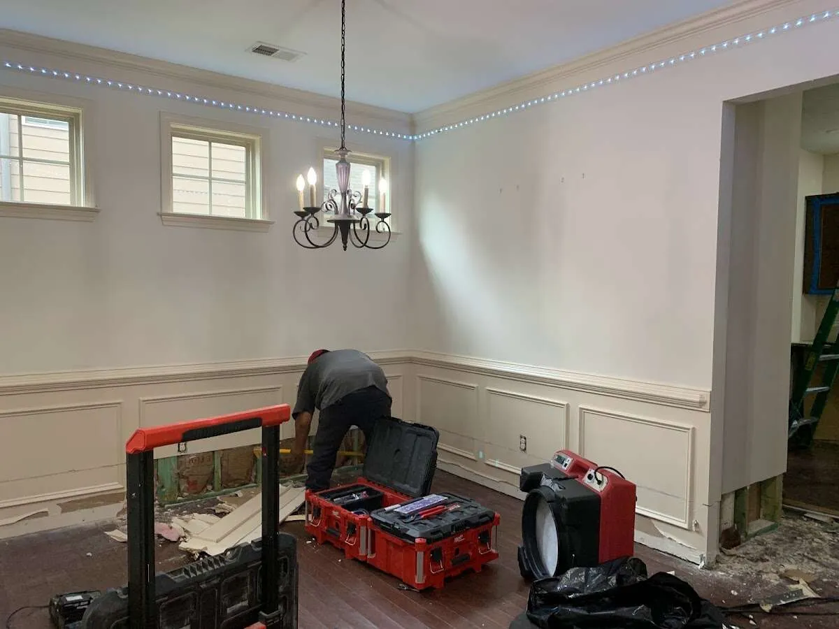 Restoration technician with professional equipment in Hampton